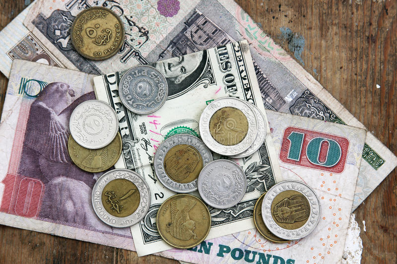 one dollar egyptian money banknote coins rusty wooden background 66253121